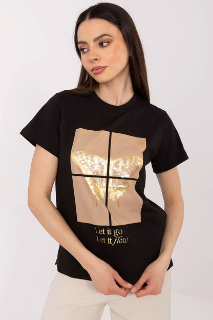 Model wearing a luxury women's t-shirt with butterfly sequin detail from Factory Price, styled for a chic everyday look.