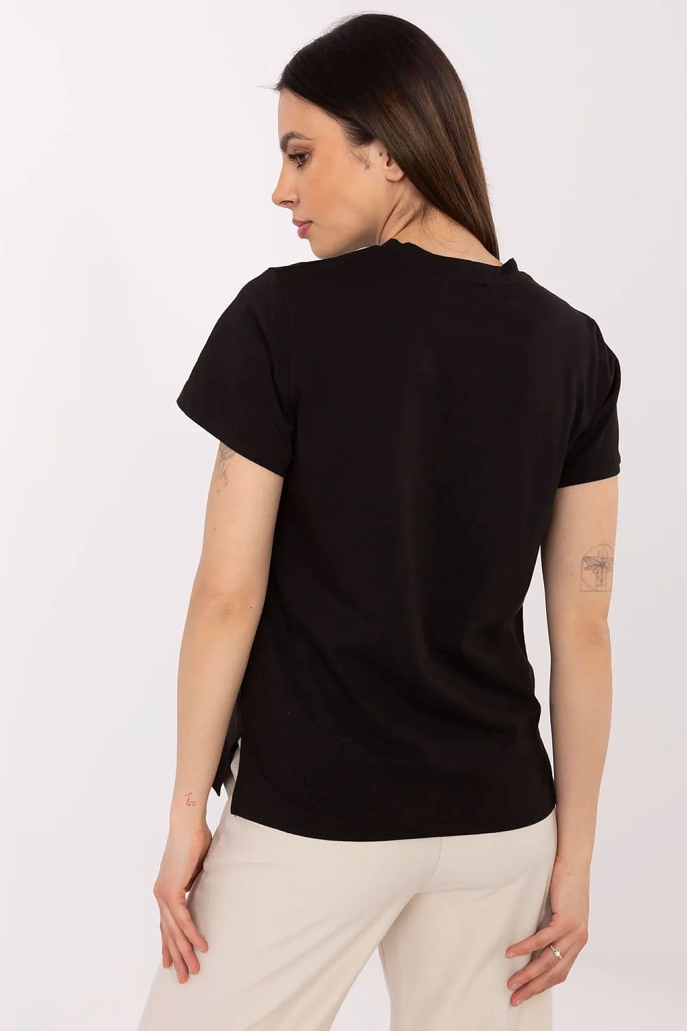 Lifestyle shot of luxury women's t-shirt with butterfly sequins by Factory Price, ideal for comfortable yet stylish outfits.