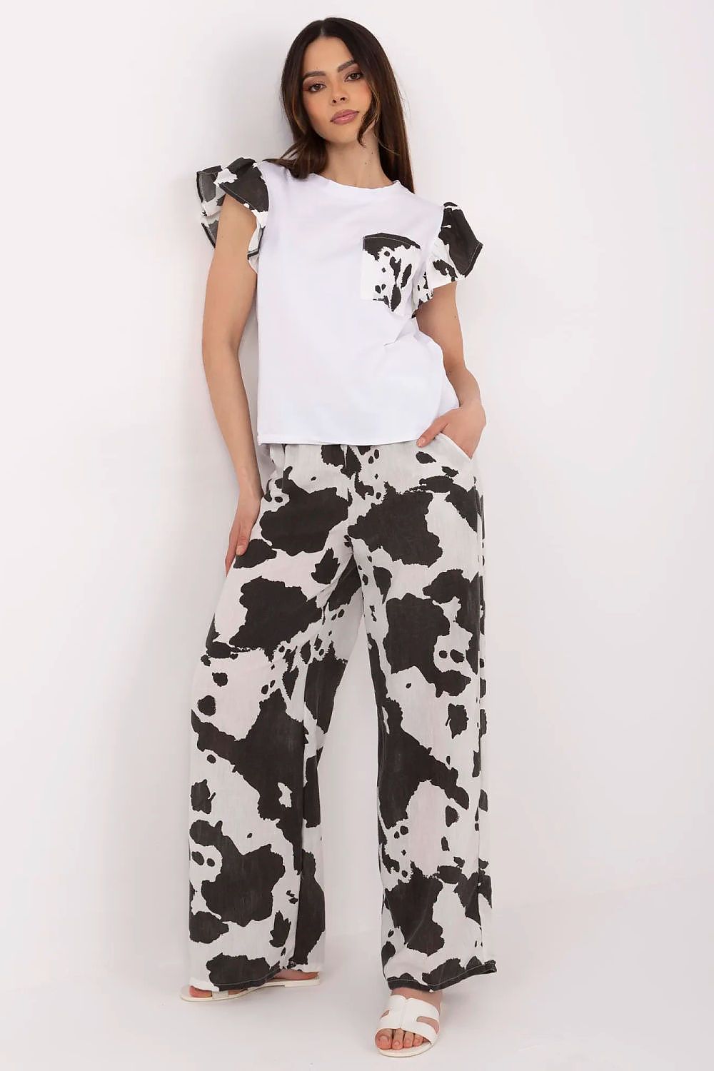 Elegant Italy Moda women's set featuring a stylish ruffled sleeve blouse and high-waisted wide-leg pants, perfect for sophisticated casual outings, crafted for comfort and fashion.