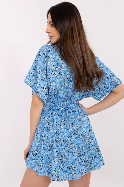 Chic women's floral jumpsuit by Italy Moda, showcasing a comfortable fit with a stylish skirt overlay and a flattering belted waist.