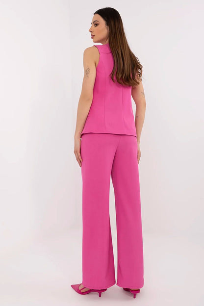 Full outfit view of the stylish women's vest and high-waisted pants set by Italy Moda, ideal for office wear or chic evening events, featuring practical side slip pockets.