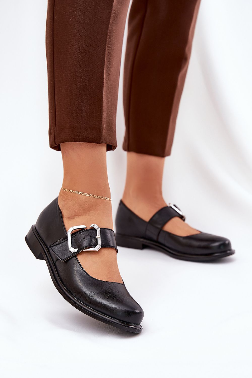 Elegant women's leather half shoes by Step in Style featuring a stylish buckle strap and comfortable 2 cm flat heel.