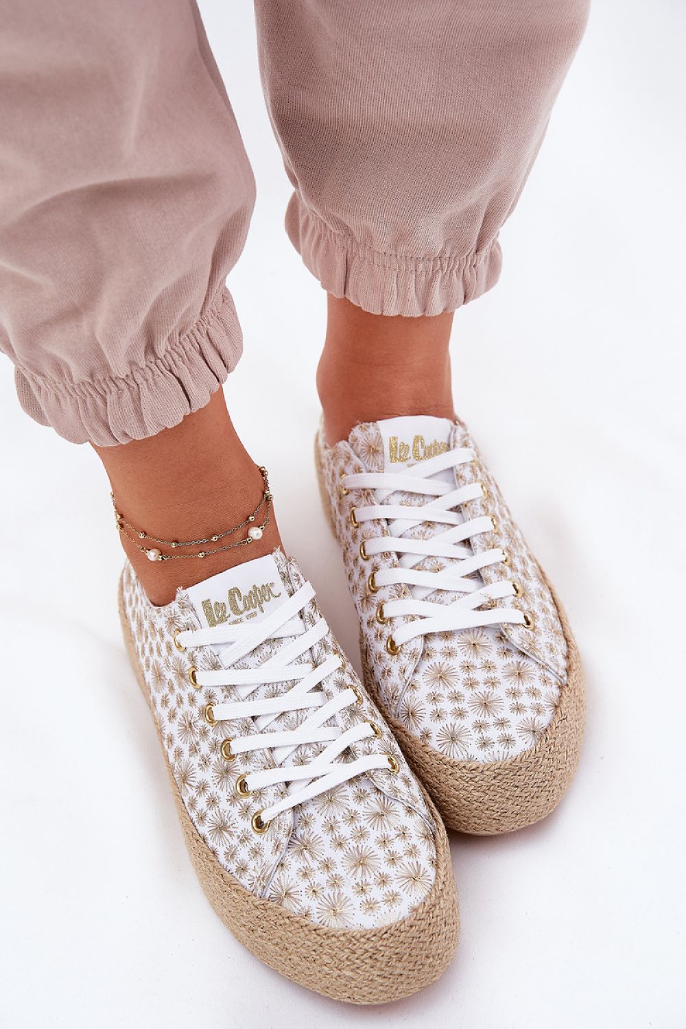 Elegant Lee Cooper women's textured sneakers showcasing a contemporary design, perfect for adding sophistication to casual ensembles.