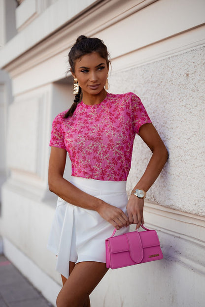 Elegant LaBalancia tulle blouse in semi-transparent material, exemplifying lightness and sophistication with a round neckline.