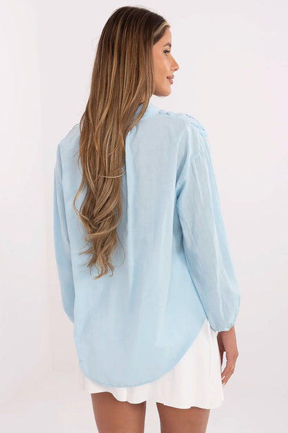 Model gracefully wearing the Och Bella boho style cotton blouse paired with stylish accessories, beautifully illustrating its trendy versatility.