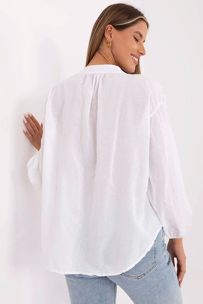 Elegant Och Bella boho style cotton blouse featuring long puffy sleeves and a v-neck, perfect for sophisticated casual wear. Available in sizes S, M, L, XL.