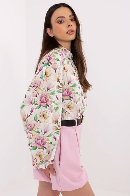 Close-up of feminine floral design on Lakerta's long sleeve shirt, embodying luxury and chic style for discerning women.