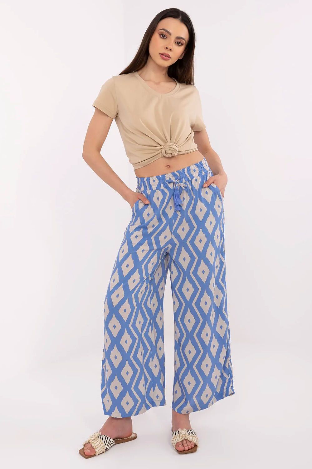 Sophisticated high-waist trousers for women by Sublevel, made from breathable viscose with decorative prints, perfect for eco-conscious fashion.