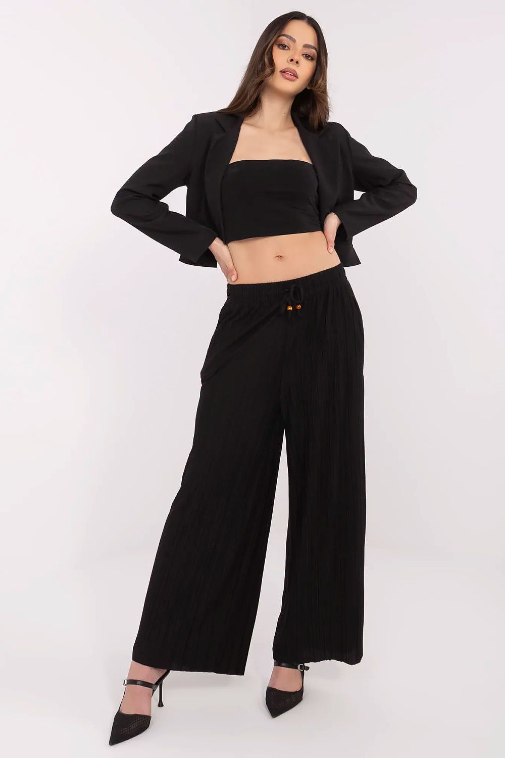 Luxury women's high-waist wide-leg trousers by Sublevel featuring elegant pockets and a sophisticated design, perfect for casual and formal outings.