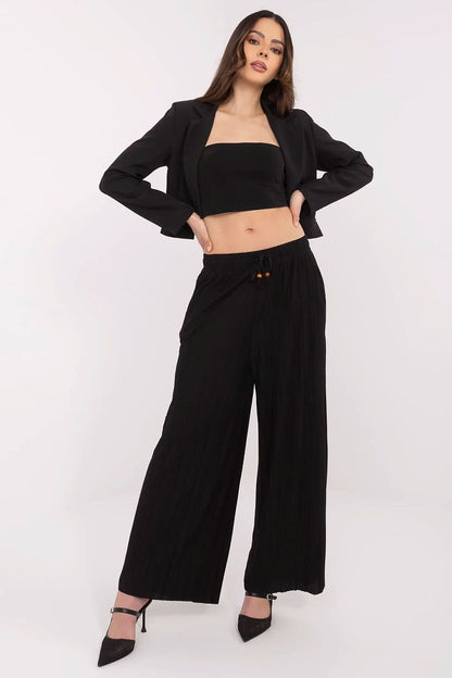 Luxury women's high-waist wide-leg trousers by Sublevel featuring elegant pockets and a sophisticated design, perfect for casual and formal outings.