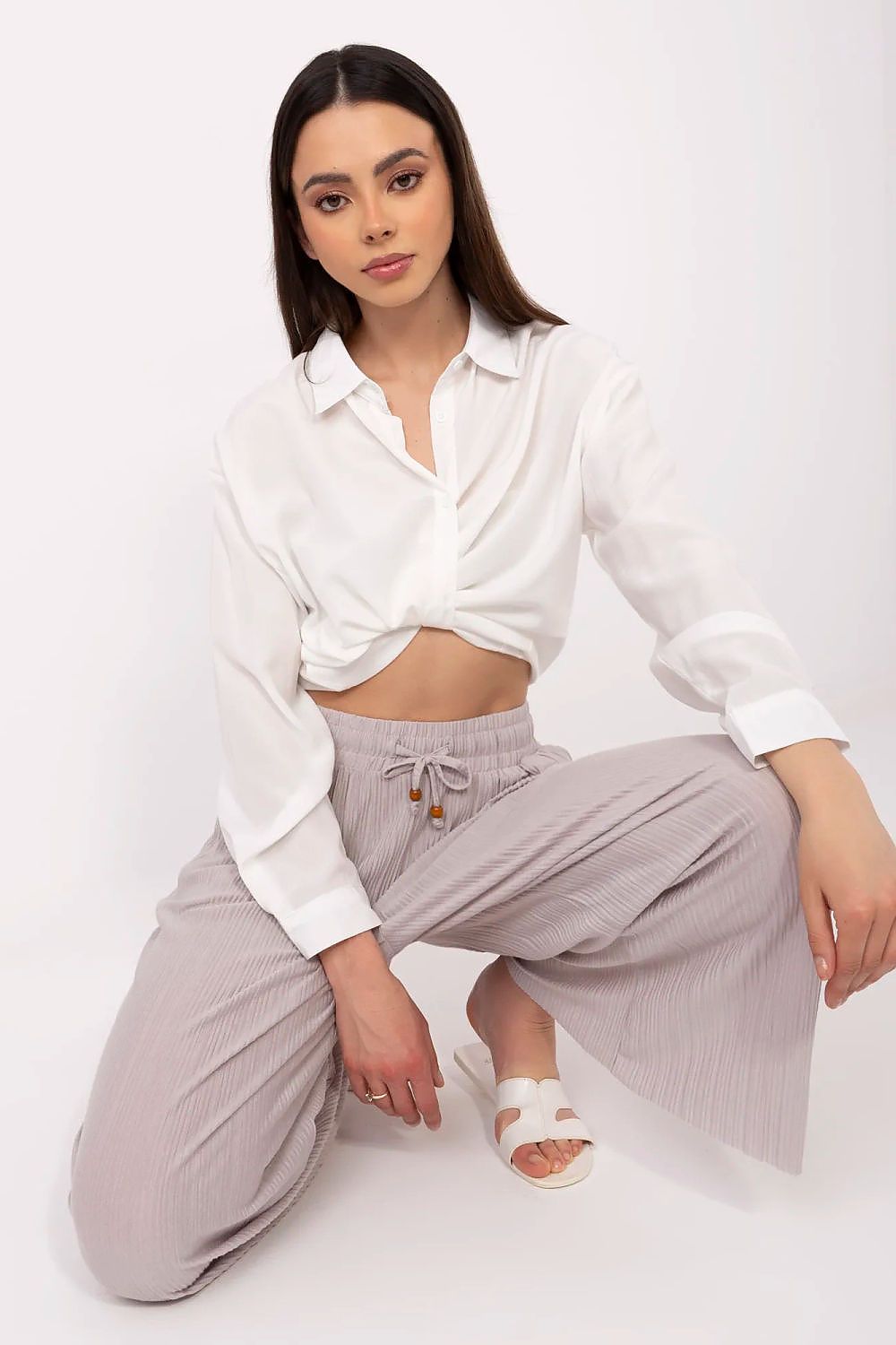 Stylish high-waist trousers for women by Sublevel, featuring a tie waist and elegant pockets, crafted in a luxe blend of viscose and polyester.