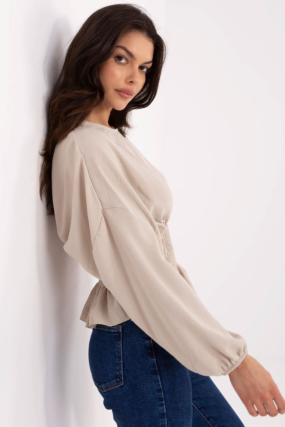 Chic close-up of Sublevel's polyester blouse, showcasing the romantic puffy sleeves and flattering silhouette.