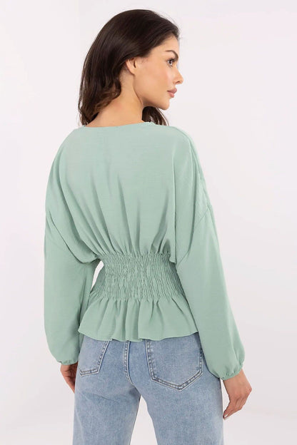 Sublevel's stylish women's blouse in polyester, perfect for formal and casual wear, highlighted by soft puffy sleeves.