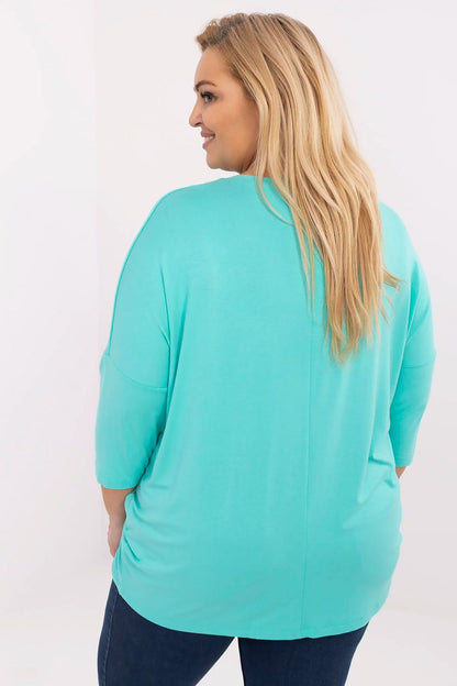 Luxurious soft viscose blend fabric of a Relevance plus size blouse, highlighting comfort and elegance for curvier women.