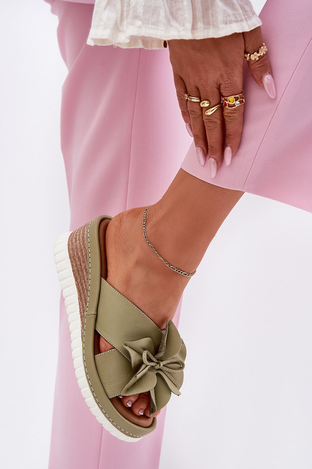 Sophisticated natural leather wedge flip-flops for women with floral accent, crafted by Step in Style for ultimate comfort.