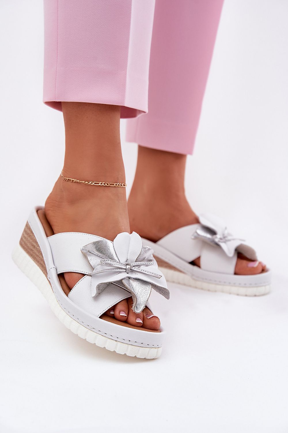 Elegant women's wedge flip-flops made from premium natural leather, featuring a charming flower design, available from Step in Style.