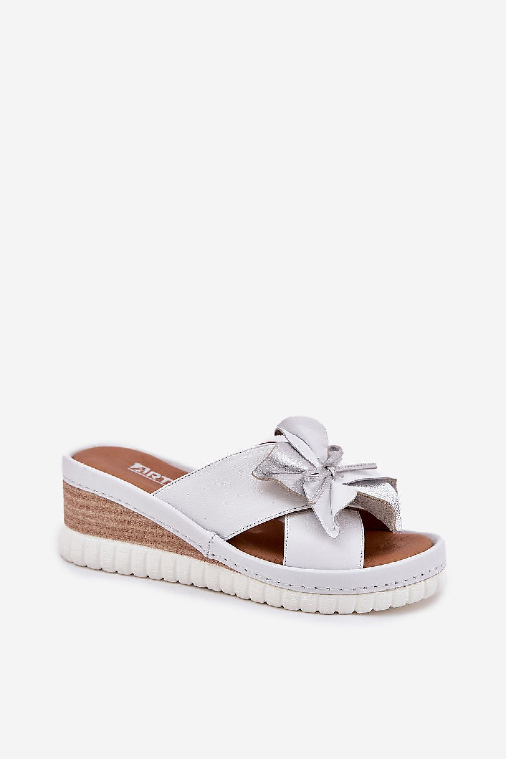 Chic natural leather wedge flip-flops for women with flower detail, designed for luxury and comfort by Step in Style.