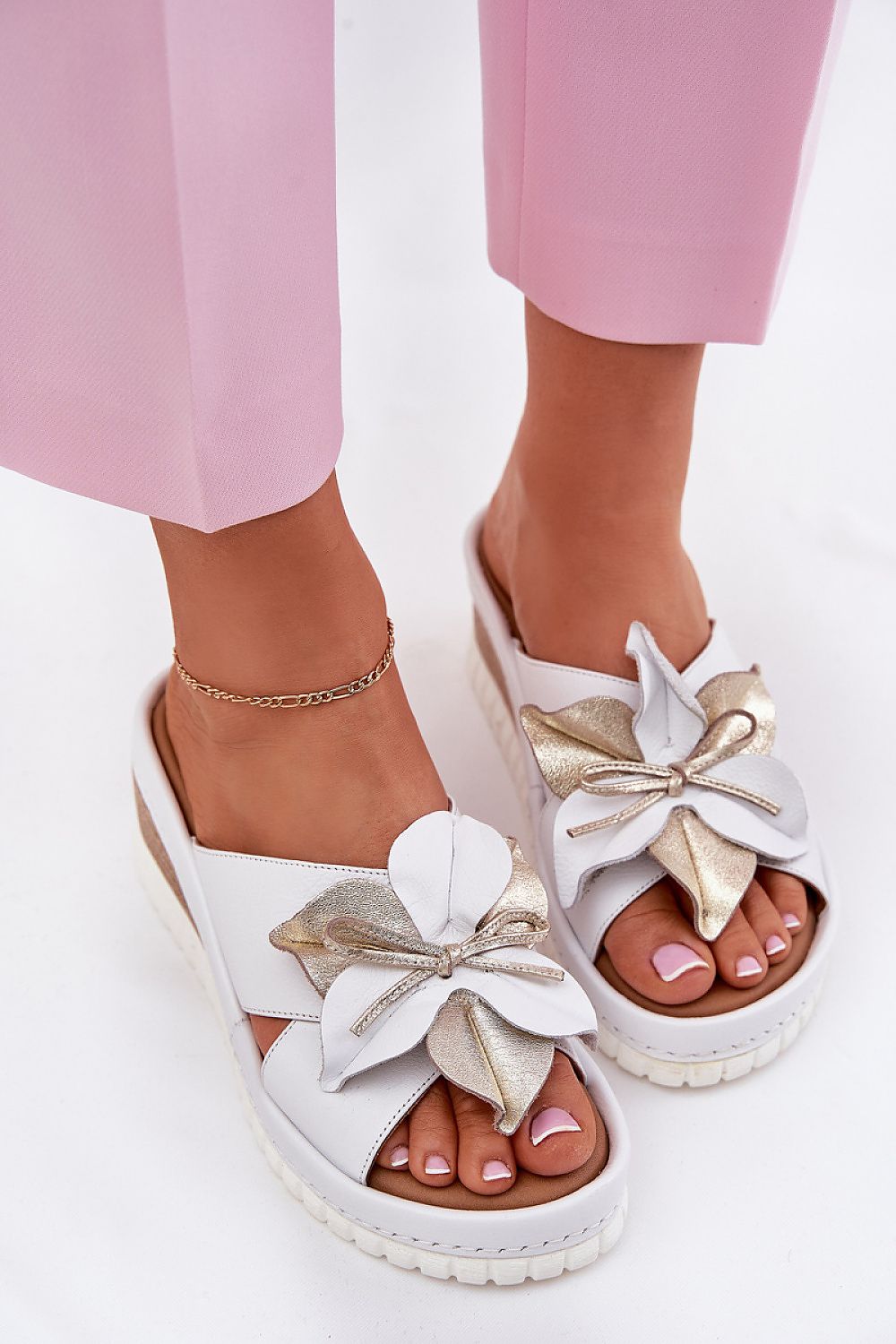 Stylish summer footwear by Step in Style, Luxury Women's Natural Leather Wedge Flip-Flops with a chic flower accent, ideal for casual outings.