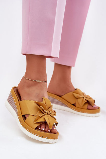 Step in Style Luxury Women's Natural Leather Wedge Flip-Flops displayed on a stylish surface, highlighting the comfort and elegance of summer fashion.