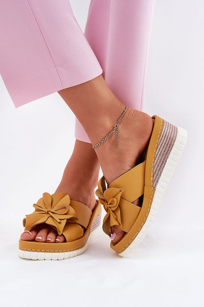 Luxury women's natural leather wedge flip-flops by Step in style, featuring a decorative flower detail and a comfortable soft insole, available in EU sizes 36-41.