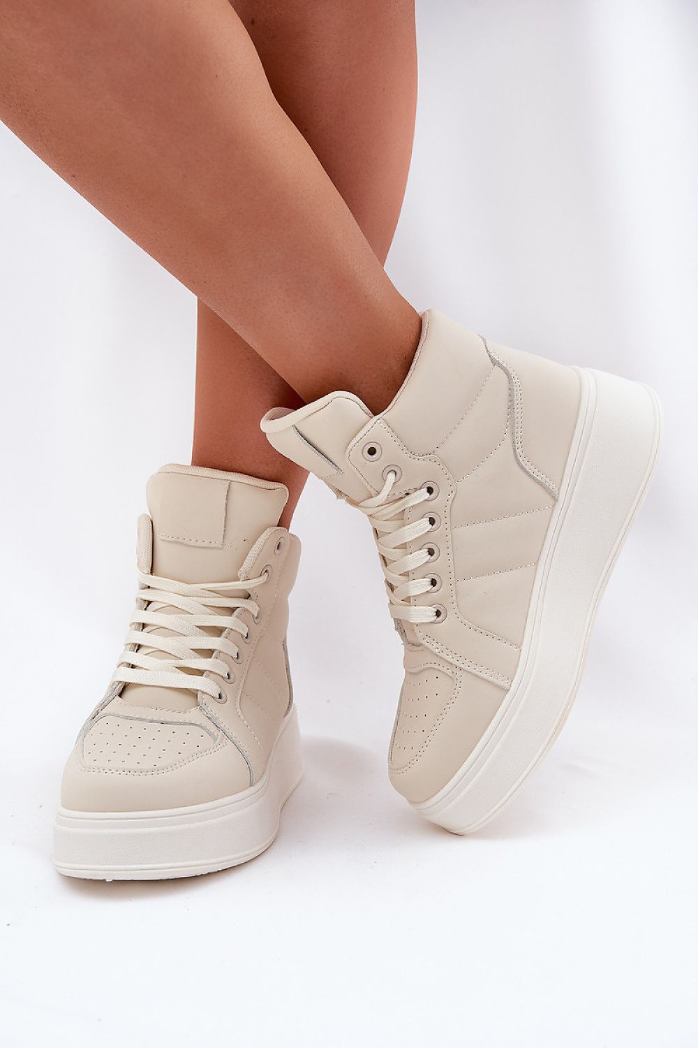 Close-up of the platform comfort feature of high-top women's sneakers, designed by Step in Style.