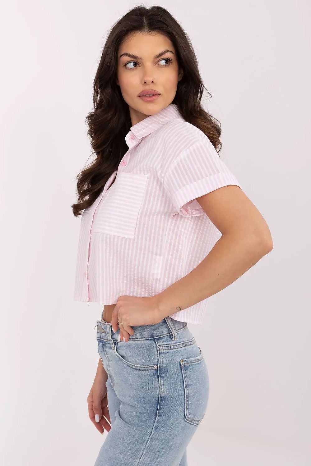 Close-up of the luxurious striped cotton fabric of the NM women's short sleeve shirt, showcasing its breathable quality and elegant design ideal for warmer days.