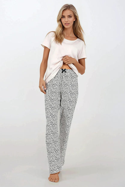 Luxurious Women's 2-Piece Cotton Pajamas Set by Momenti Per Me, showcasing a stylish short-sleeved top and long pants, perfect for comfort and elegance in any home setting.