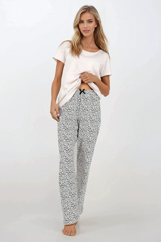 Luxurious Women's 2-Piece Cotton Pajamas Set by Momenti Per Me, showcasing a stylish short-sleeved top and long pants, perfect for comfort and elegance in any home setting.