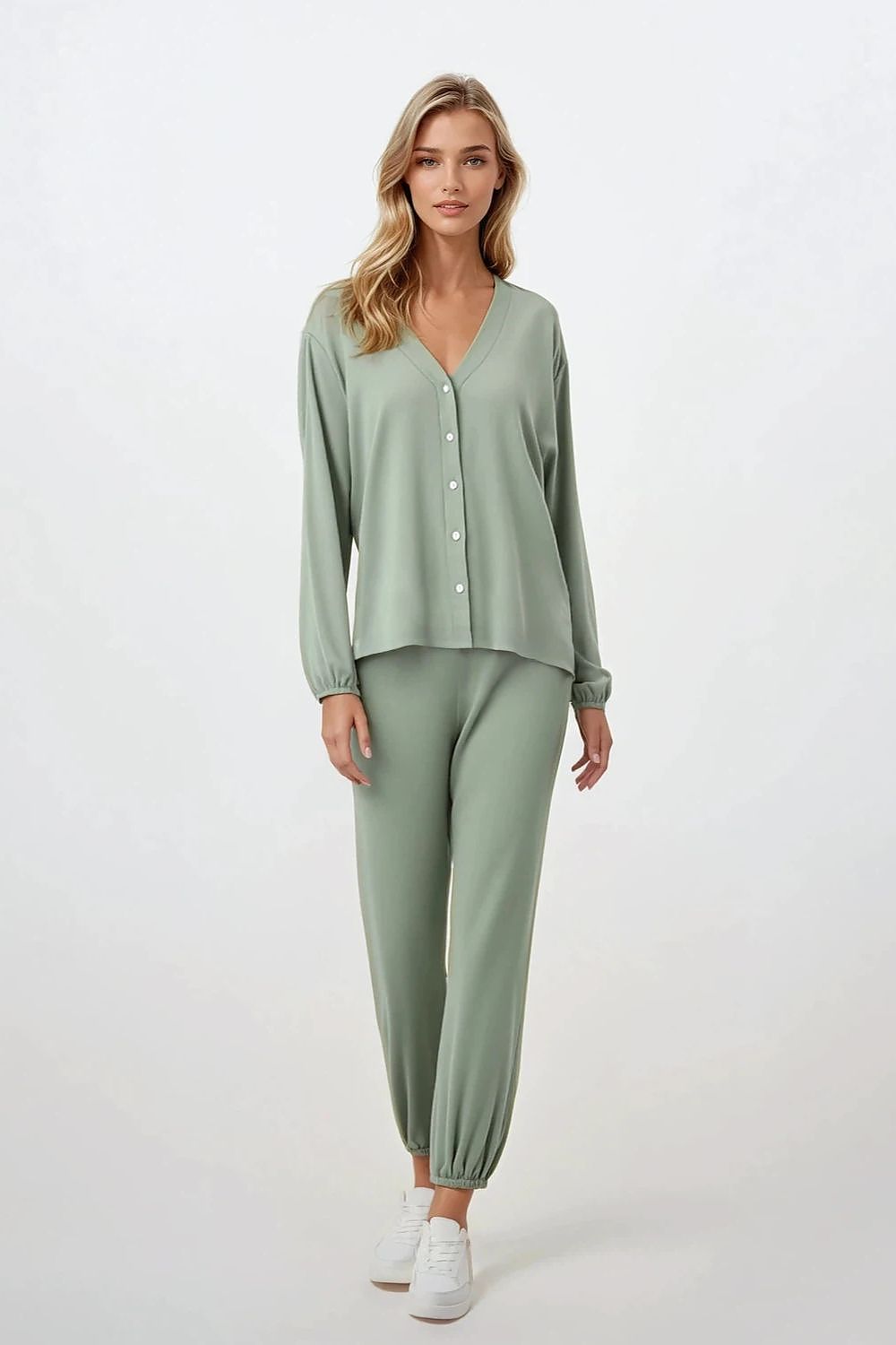 Luxurious women's pajama set by Momenti Per Me, featuring a long sleeve button-up shirt and wide leg pants made of breathable viscose, ideal for stylish sleep and homewear.