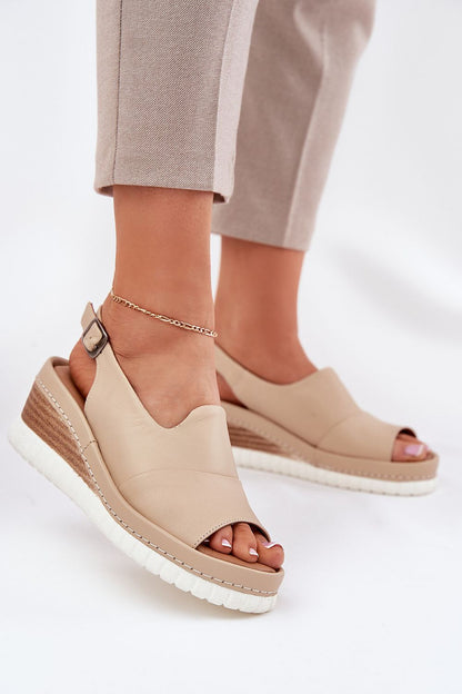 Close-up of adjustable buckle detail on Step in Style's elegant women's wedge sandals made from premium natural leather.