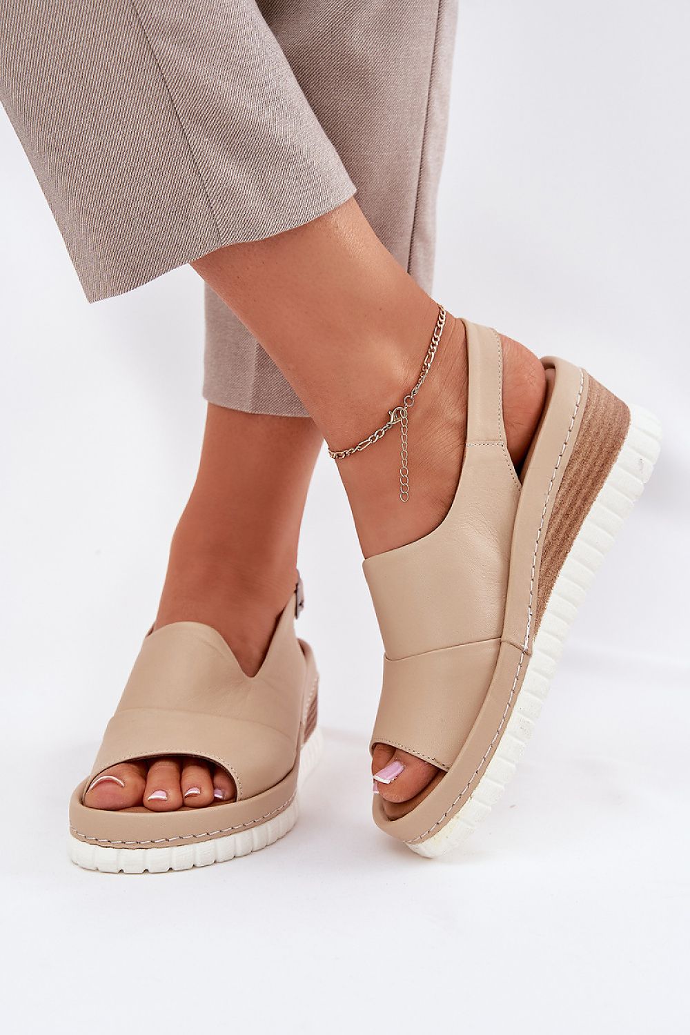 Women's wedge sandals in natural leather by Step in Style, showcasing comfort and elegance ideal for warm days.