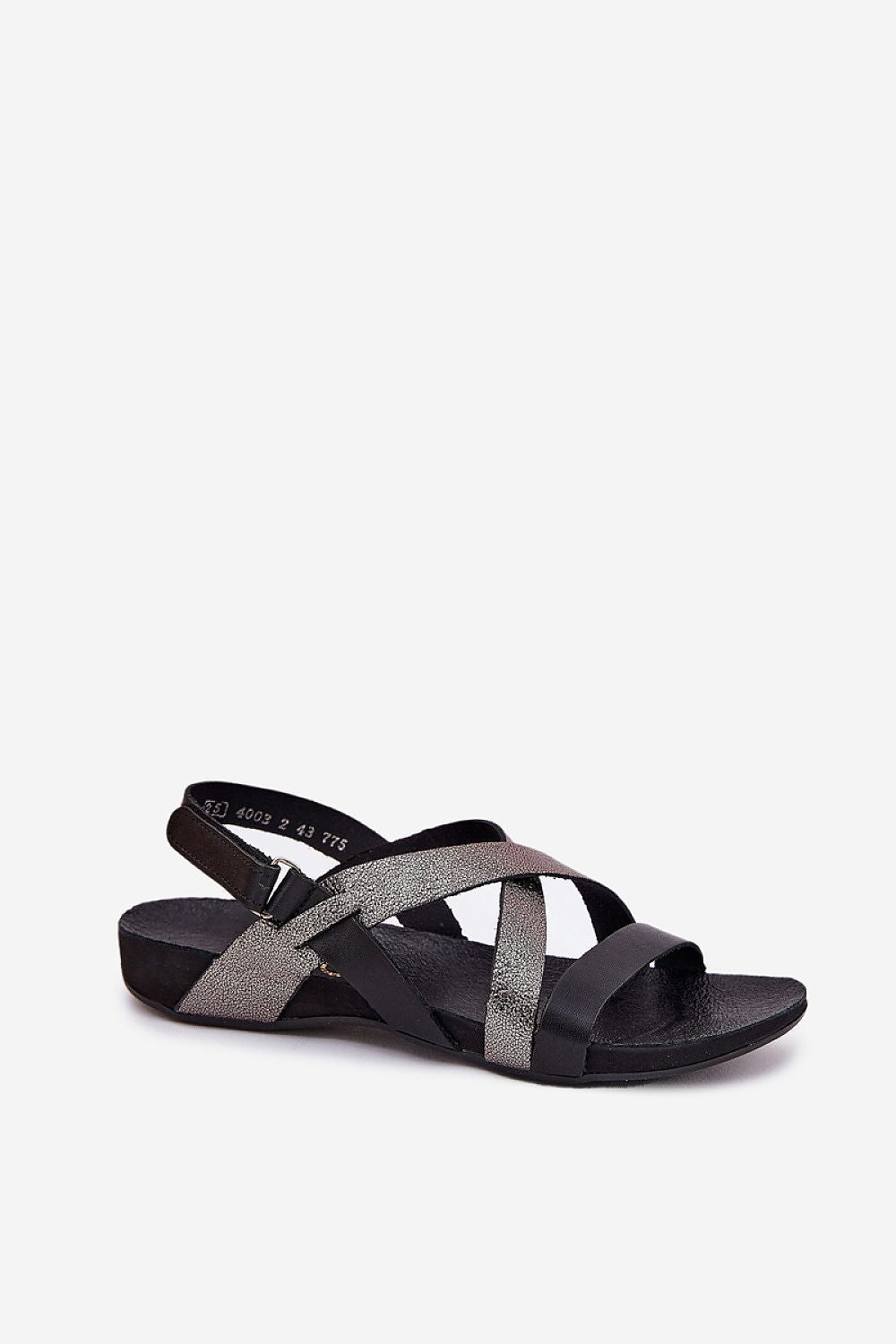 Close-up view of Step in Style women's leather sandals showcasing velcro fastening and durable natural leather material.