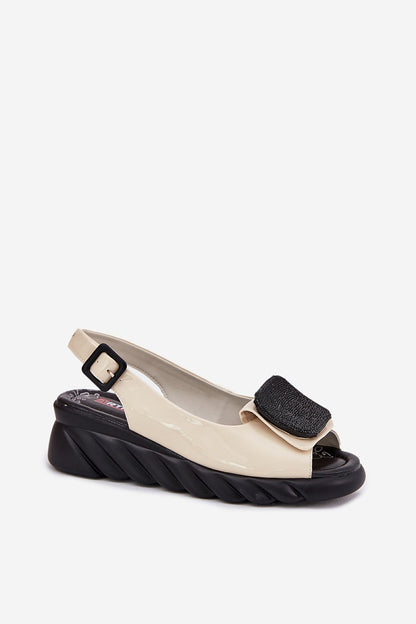 Detail of the buckle closure on Step in Style luxury women's wedge sandals, allowing for adjustable fitting.