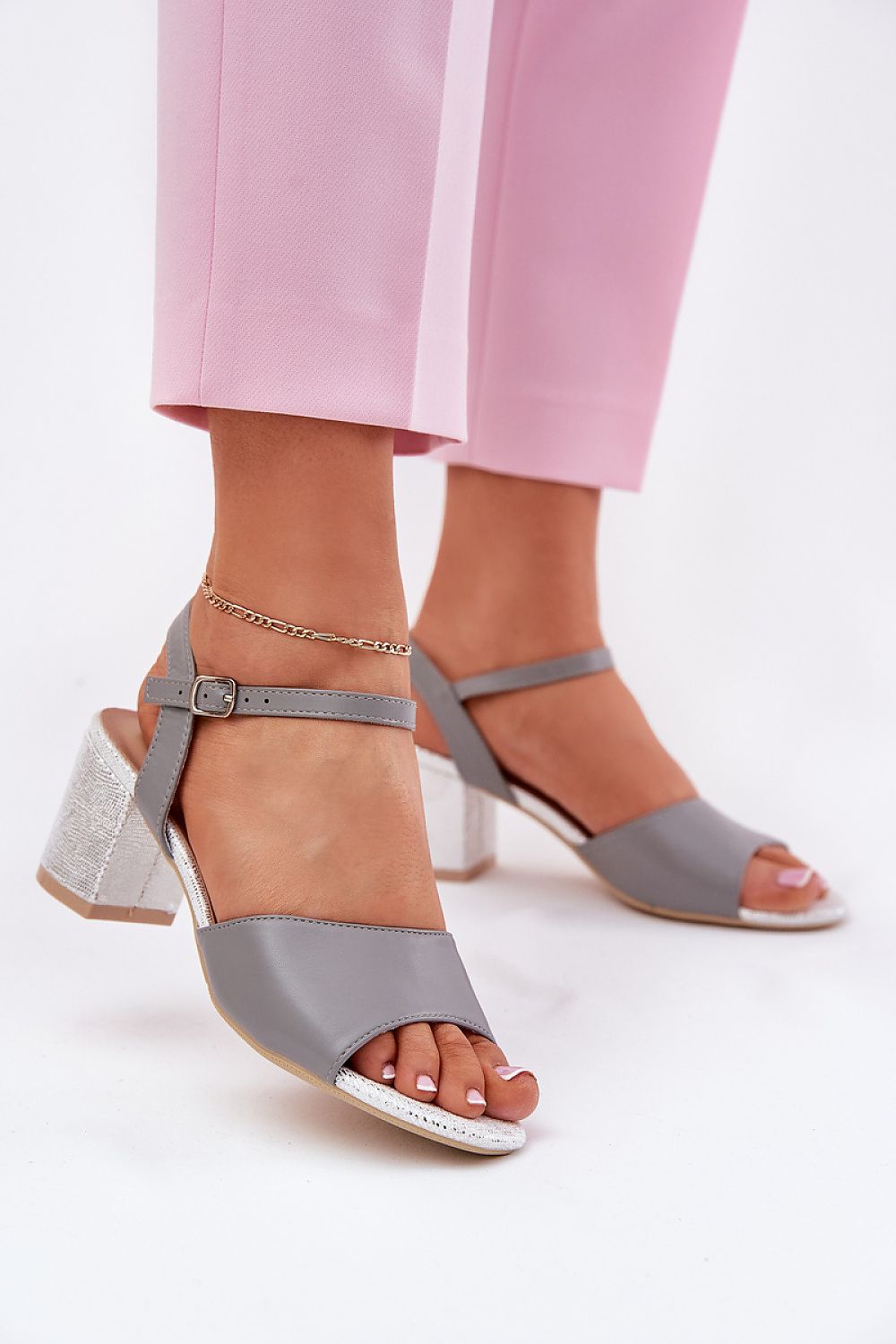 Close-up detail of Step in Style's eco leather heel sandals, featuring a comfortable natural leather footbed and a chic buckle closure.