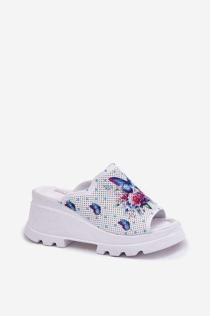 Luxurious elegant women's leather sandals by Step in style featuring a modern geometric design and an 8 cm wedge heel, perfect for summer elegance.