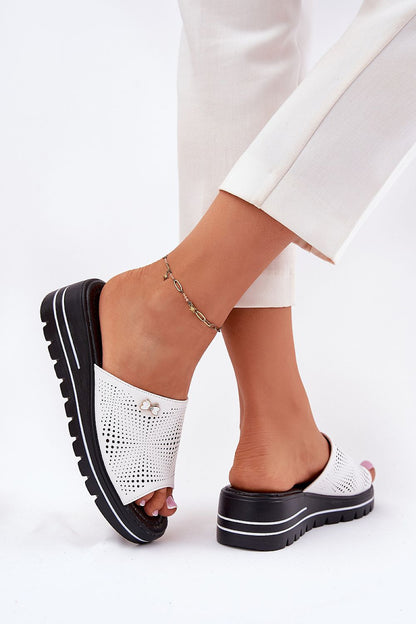 Side view of elegant women's leather wedge sandals by Step in Style, highlighting decorative strap detail and stylish summer appeal.