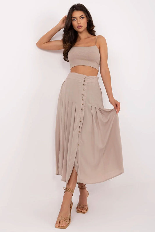 Elegant pleated midi skirt by Sublevel in eco viscose, showcasing a fashionable design perfect for everyday wear and office styling.