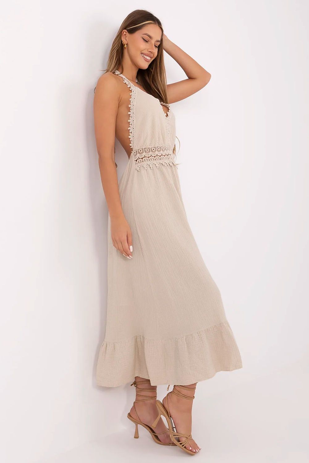 Elegant V-neck flared boho dress by Italy Moda with tied neck straps, perfect for summer outings, highlighting feminine charm and graceful silhouette.