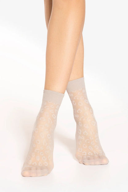Gatta women's high socks displaying an elegant leopard pattern, perfect for adding a touch of wild sophistication to any outfit.