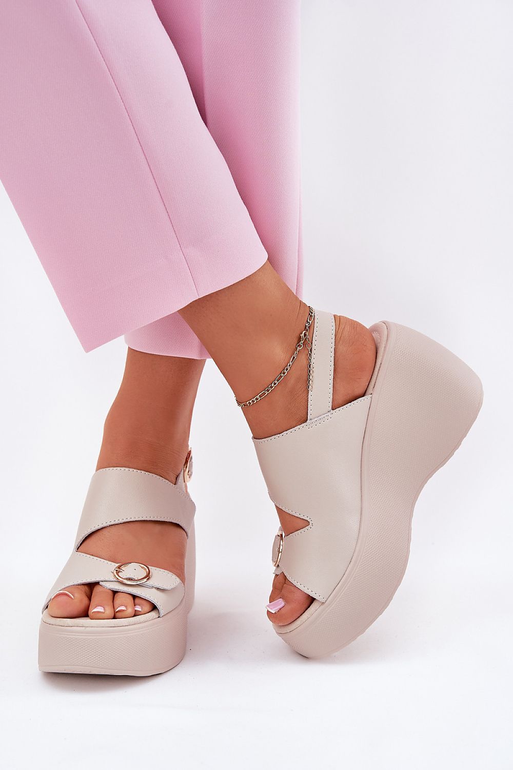 Step in style's luxurious women's natural leather sandals displayed on a stylish background, emphasising the craftsmanship and elegance.