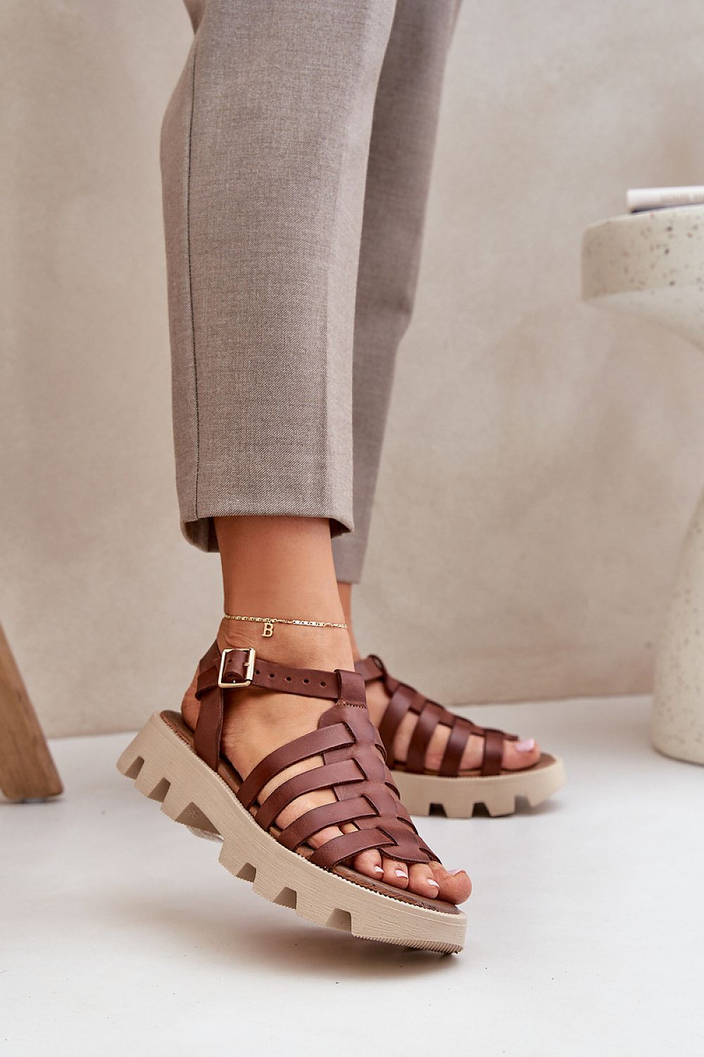 Step in Style luxury women's sandals crafted from high-quality natural leather, featuring an elegant design and adjustable buckle for a perfect fit.