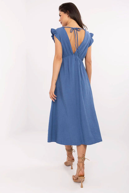 Side view of Italy Moda's lightweight cotton daydress highlighting the flared cut and ruffle sleeves for a stylish summer look.