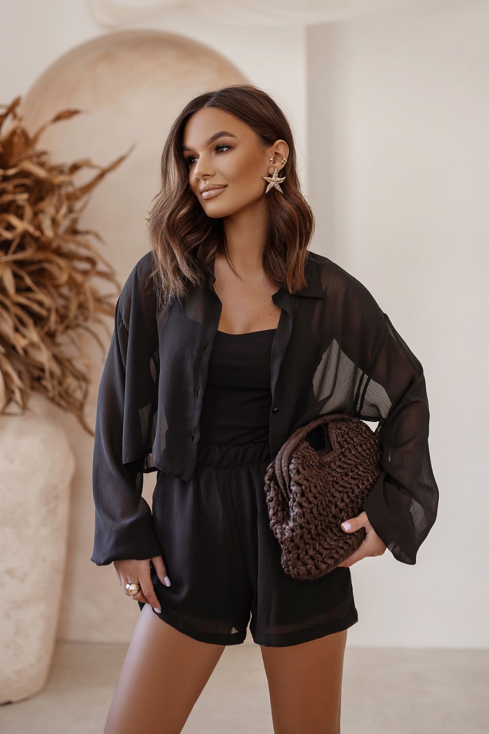 Sophisticated LaBalancia women's set displayed on a mannequin, incorporating a stylish shirt, bodysuit, and shorts, perfect for summer outings.