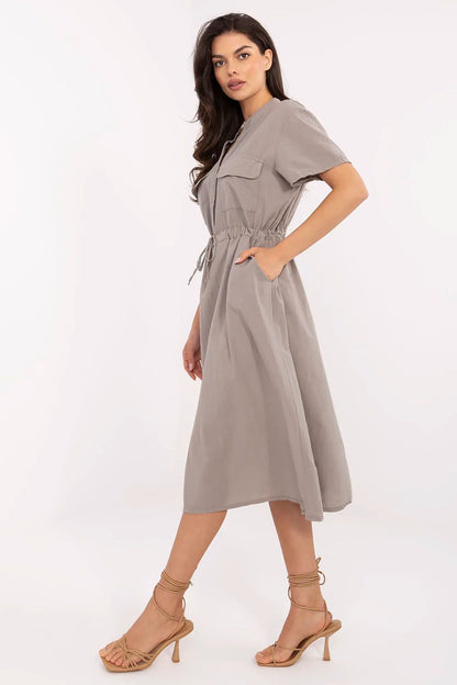Luxurious cotton midi dress by Italy Moda, showcasing a flattering flared cut, button fastening, and stylish decorative pockets for summer elegance.