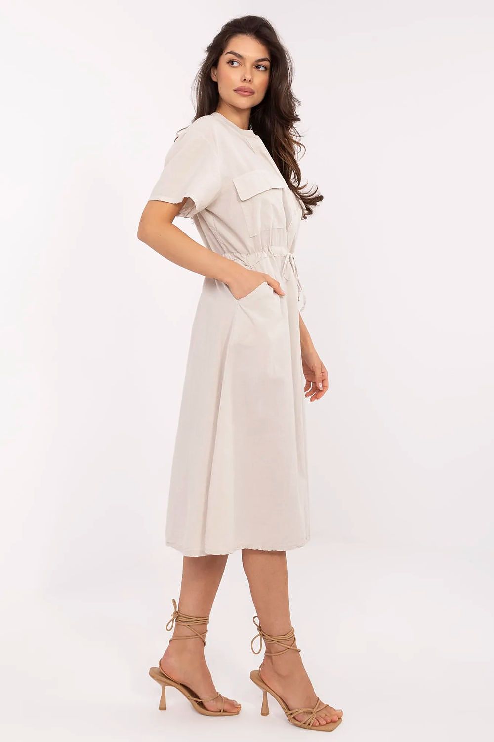 Stylish Italy Moda summer dress in breathable cotton, adorned with a flared cut and practical side pockets, ideal for elegant casual outings.