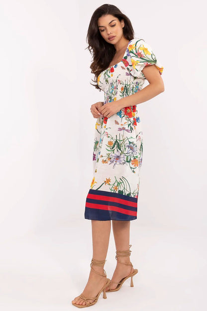 Elegant summer dress by Italy Moda featuring a flared cut and floral design, perfect for warm weather style.