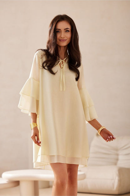 Chic knee-length Roco Fashion cocktail dress in lightweight Lyocell featuring a V-neck and 3/4 sleeves, perfect for elegant occasions.
