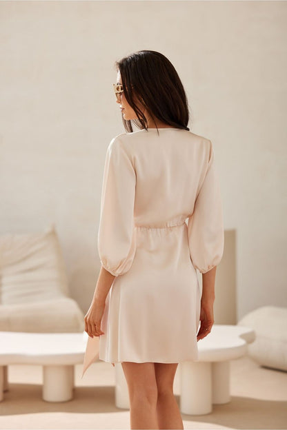 Frederica Satin Day Dress by Roco Fashion, showcasing an elegant wrap neckline, delicate puffy 3/4 sleeves, and a luxurious mini cut, perfect for various occasions.