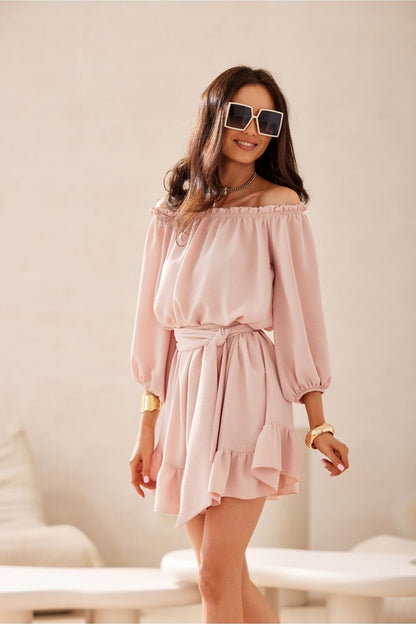 Back view of the Giulia Dress by Roco Fashion with a delightful ruffle hem, showcasing versatility for relaxed summer outings.