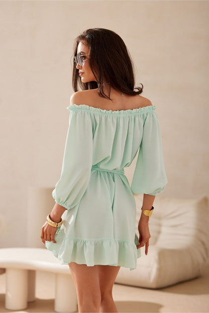 Elegant Giulia Dress by Roco Fashion featuring a stunning Spanish neckline and delicate ruffle hem, perfect for summer occasions.